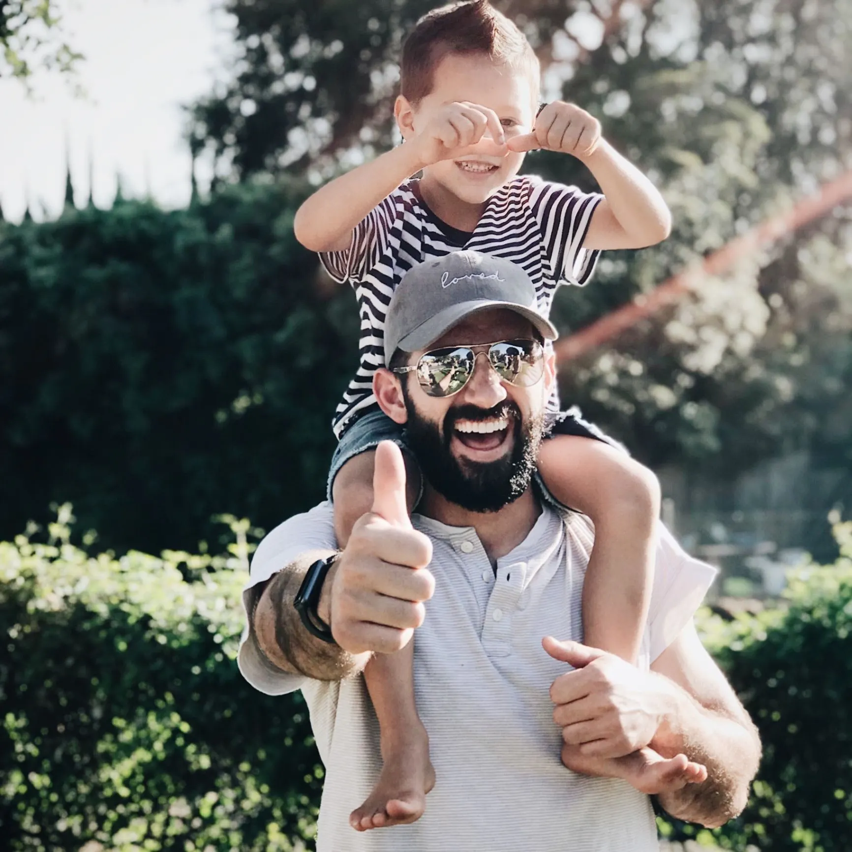 Father giving his child a shoulder ride
