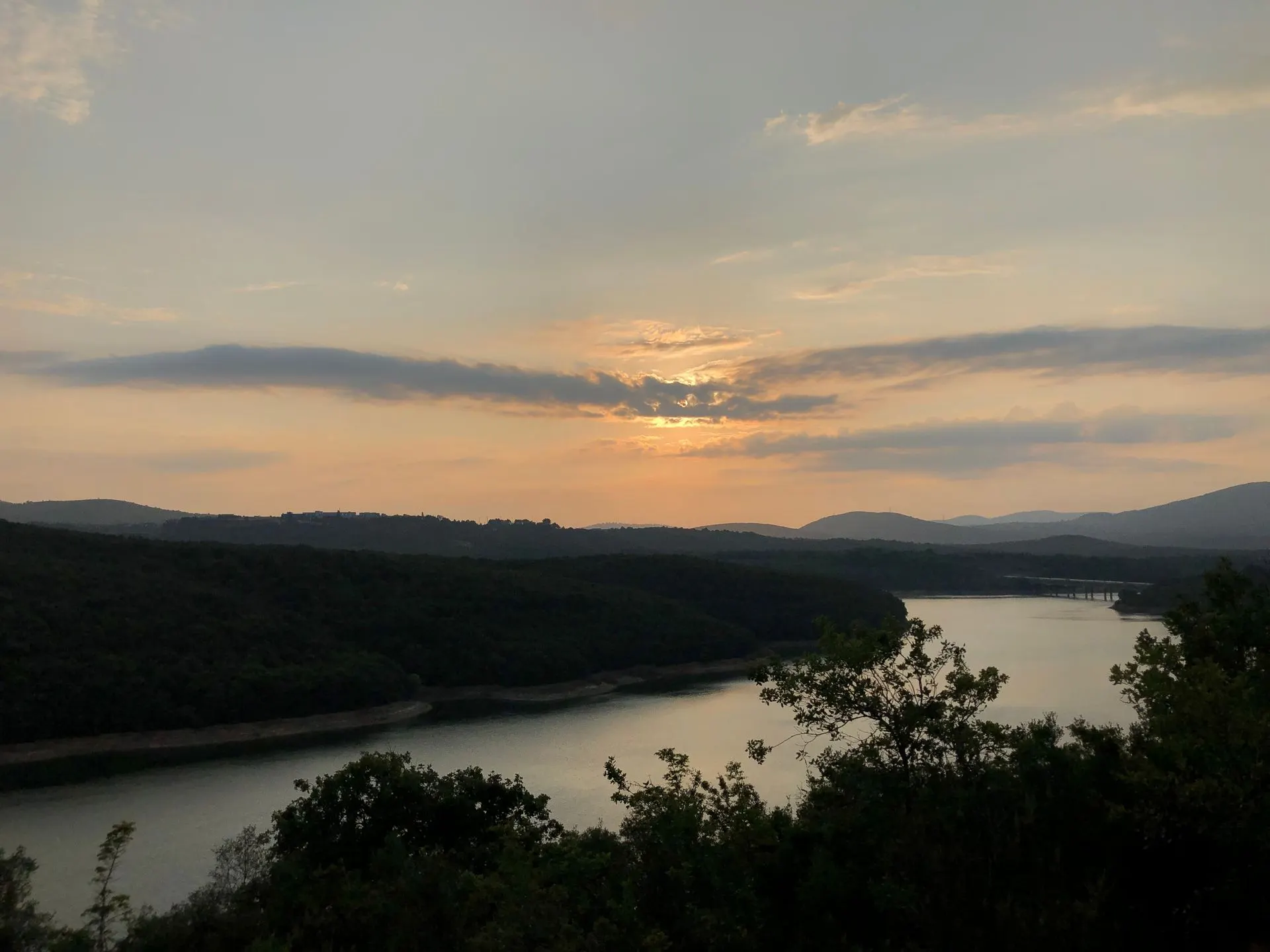 River winding through a valley at sunset